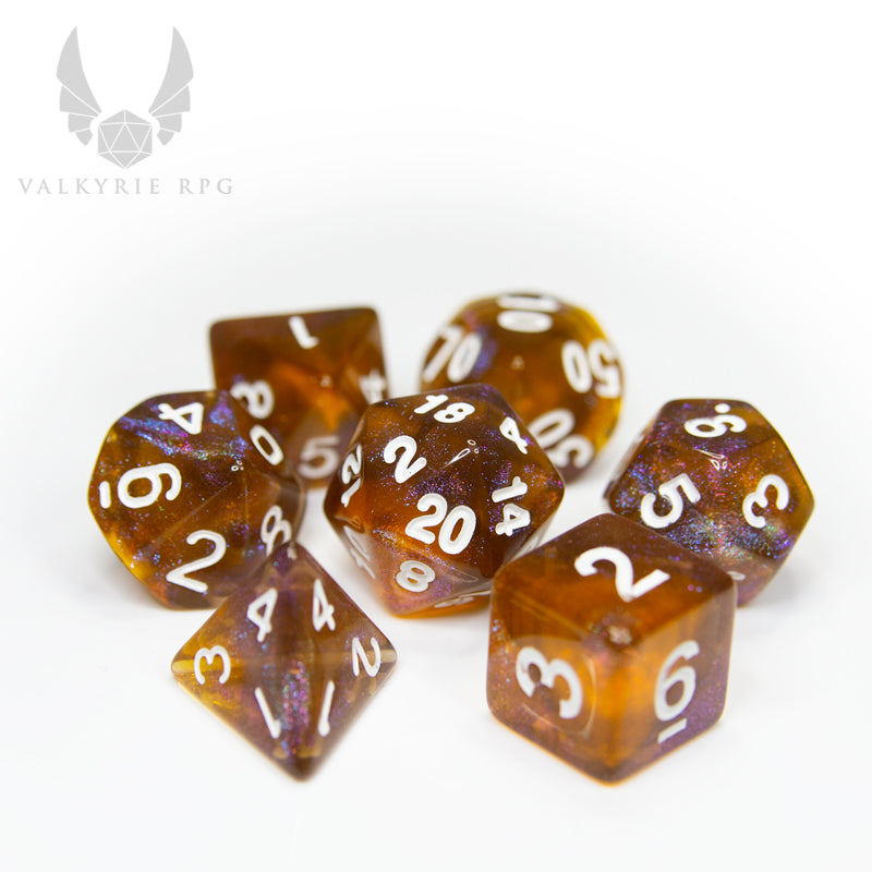 Valkyrie RPG | Online Dice Store UK | Helheim Brass Dragon - Beautiful colour shifting purple and brass toned glitters with blends of deep varying tones of amber finished with white inking. on white background
