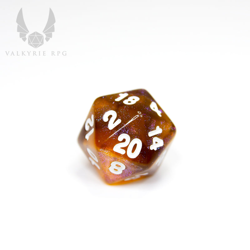 Valkyrie RPG | Online Dice Store UK | Helheim Brass Dragon - Beautiful colour shifting purple and brass toned glitters with blends of deep varying tones of amber finished with white inking.  close up of d20 on white background