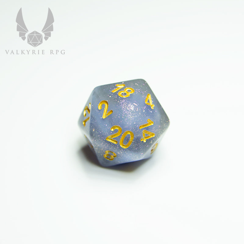 Valkyrie RPG | Online Dice Store UK | Niflheim Vela - Plumes of opaque blue-grey, flowing and coiling between voids of subtle grey resin infused with fine purple hued glitters; all finished with gold inking. close up of d20