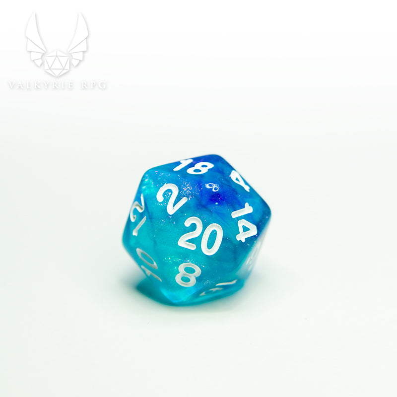 Valkyrie RPG | Online Dice Store UK | Helheim Sea Sprite - Colour shifting purple and silver toned glitters with blends of pale blue and violet along with white inked numbering. close up of d20 on white blackground