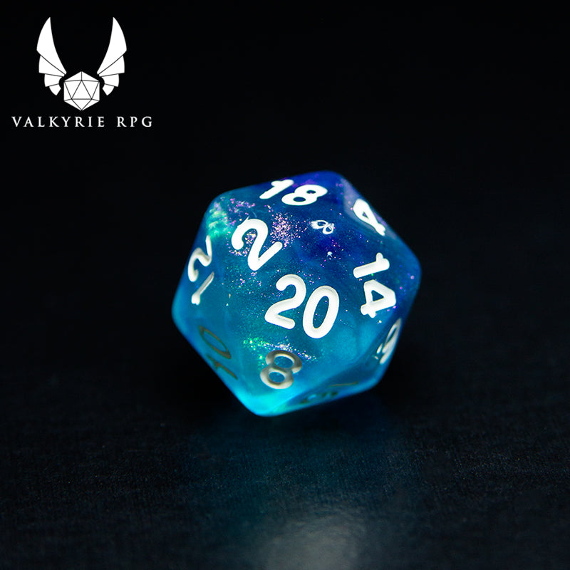 Valkyrie RPG | Online Dice Store UK | Helheim Sea Sprite - Colour shifting purple and silver toned glitters with blends of pale blue and violet along with white inked numbering. close up of d20 on black background